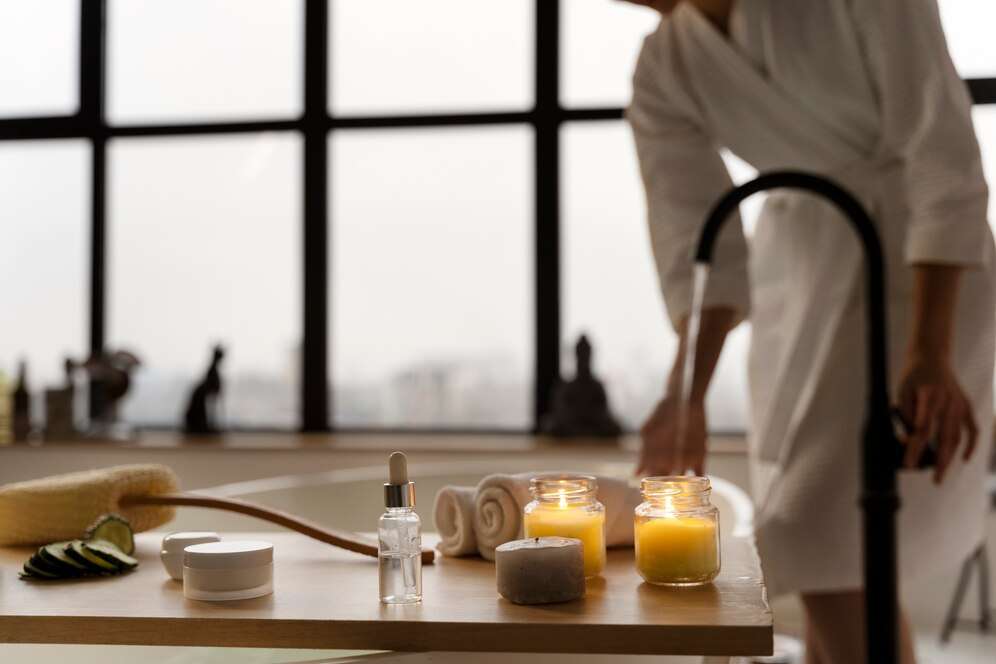 young-woman-checking-water-before-taking-bath_23-2149239340
